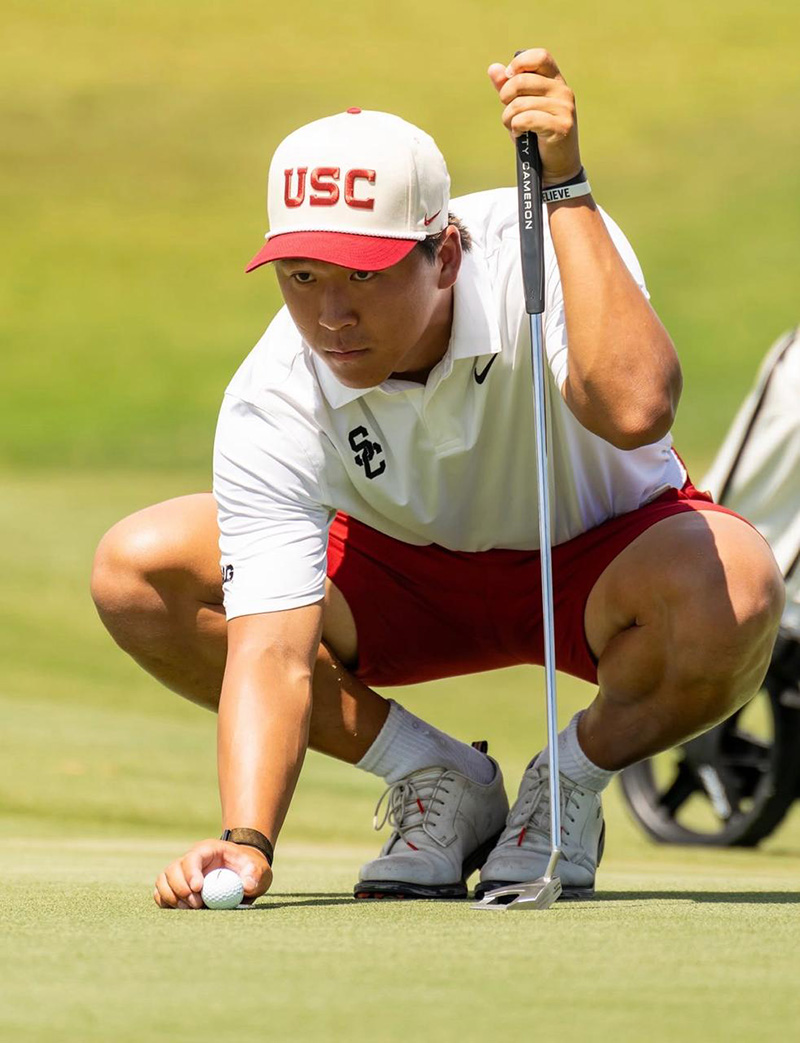 Joshua Hong lines up a putt in USC Men’s Golf uniform during his 2026–27 sophomore season.