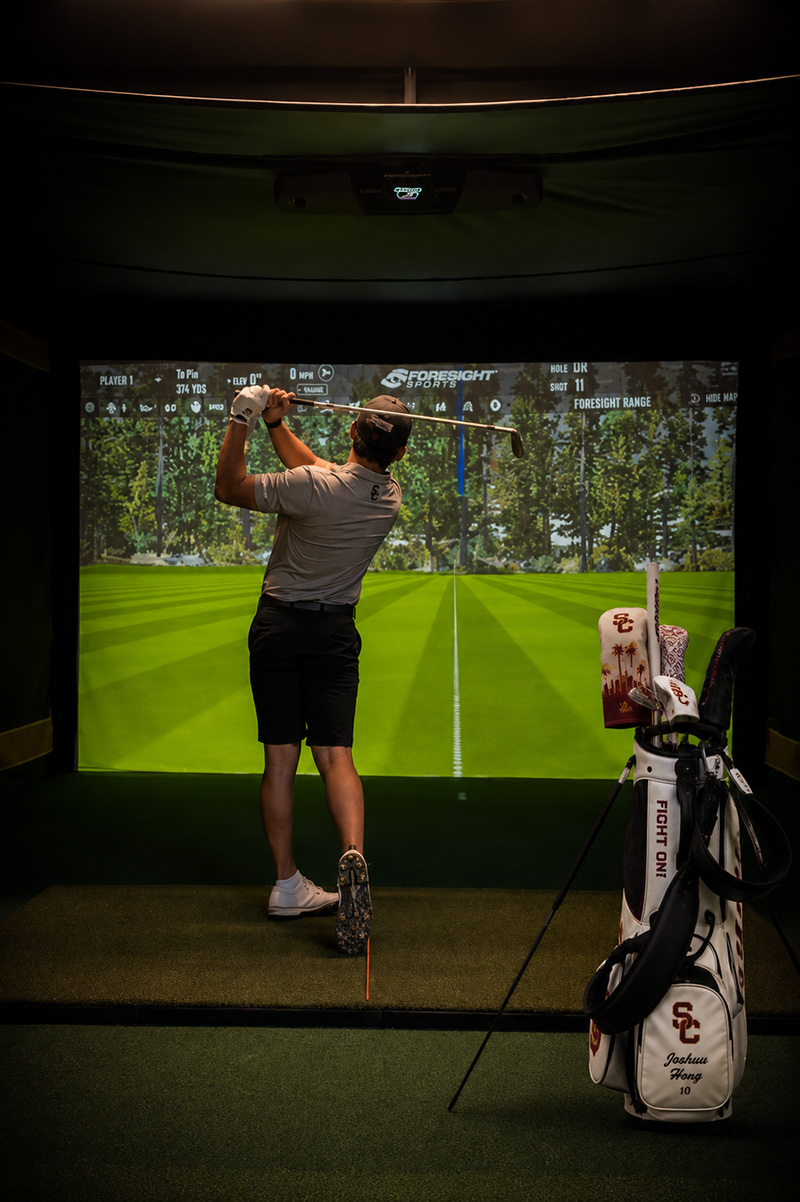 Joshua Hong during an indoor golf practice session at USC in Los Angeles, California.